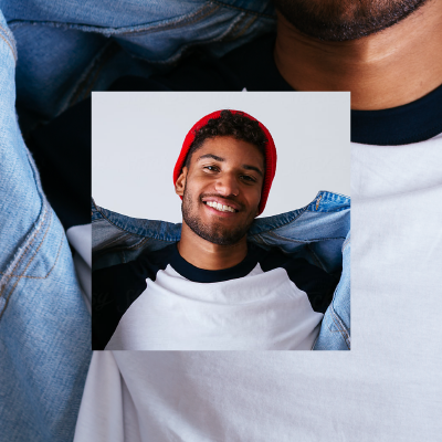 Guy in t-shirt and beanie smiling