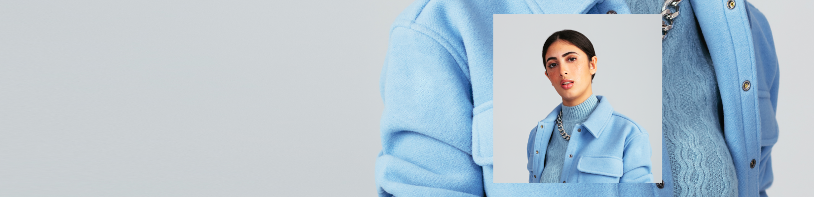 JLL_50627_I6a_WebHero_PNG_1mb_1650x400 Dark haired girl in blue sweater and jacket
