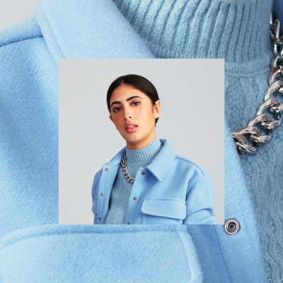 Dark haired girl in blue sweater and jacket