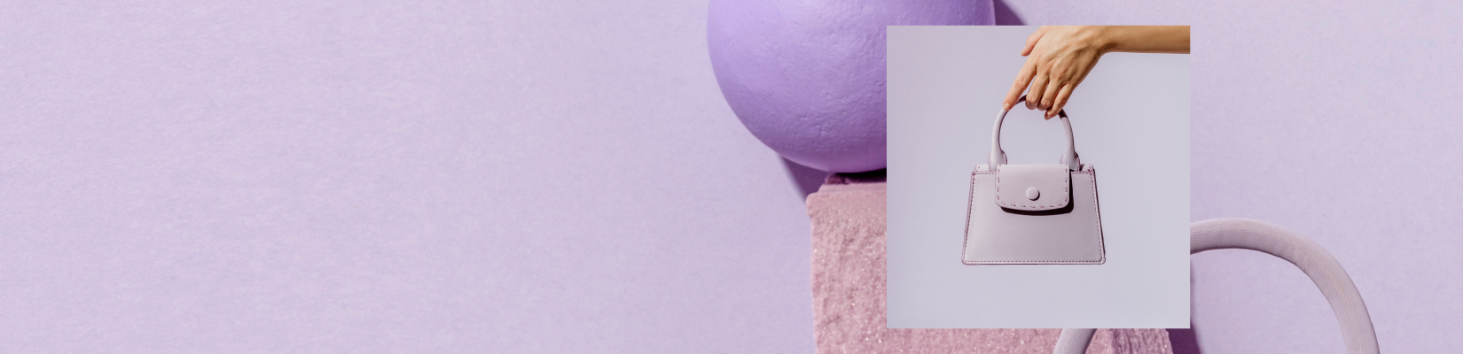 Small lavender leather satchel held over a lavender abstract background