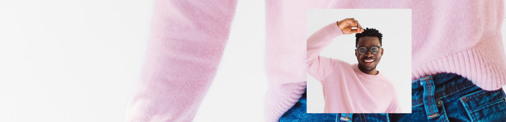 Man in pink sweater and eye glasses smiling
